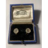 A PAIR OF VINTAGE STERLING SILVER CLIP ON EARRINGS WITH CLEAR STONES IN A PRESENTATION BOX