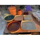 AN ASSORTMENT OF STONEWARE ITEMS TO INCLUDE A BREAD BIN, JUG AND DISHES ETC