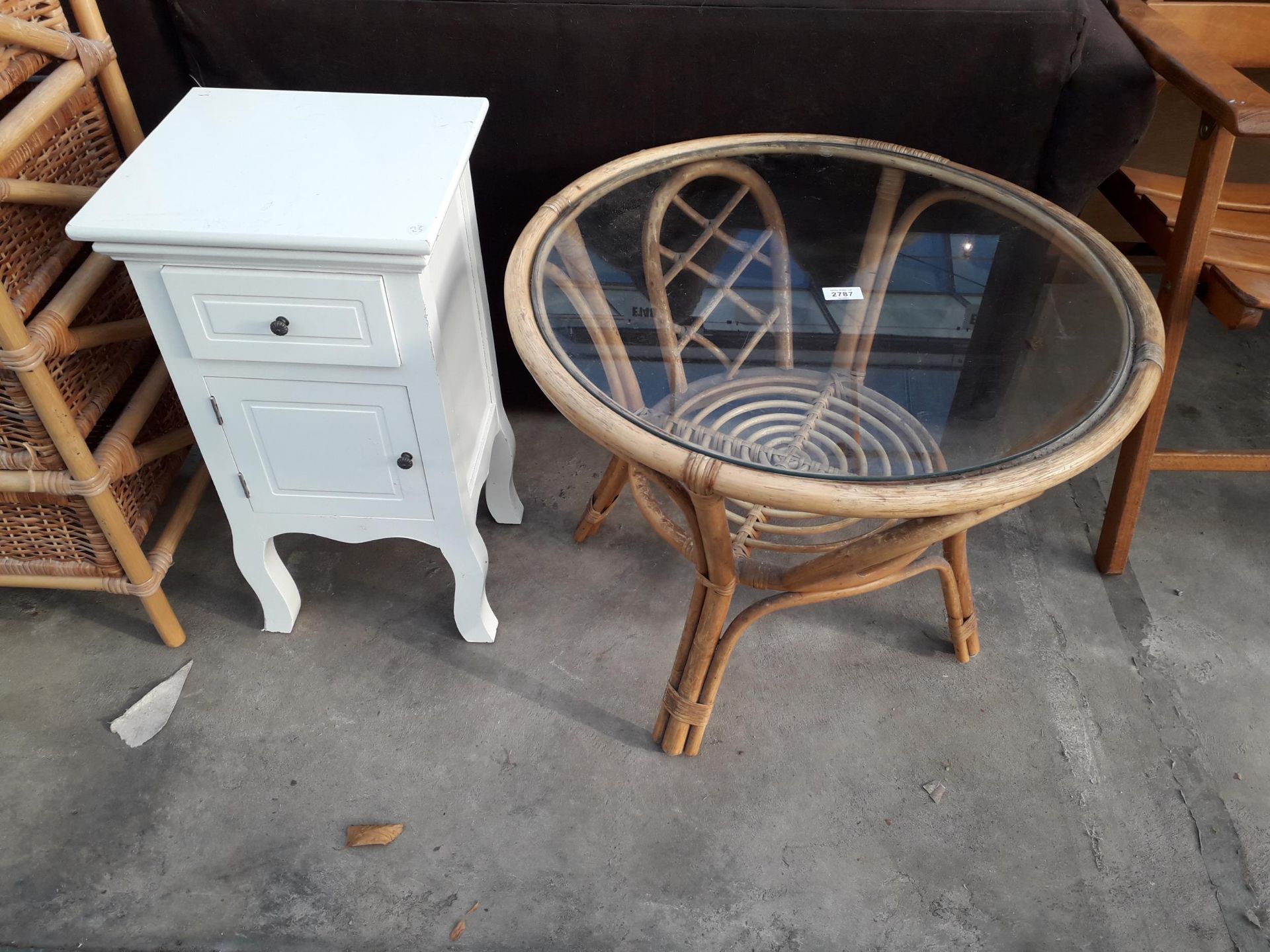 A 26" DIAMETER BAMBOO TABLE WITH GLASS TOP AND WHITE PAINTED BEDSIDE LOCKER