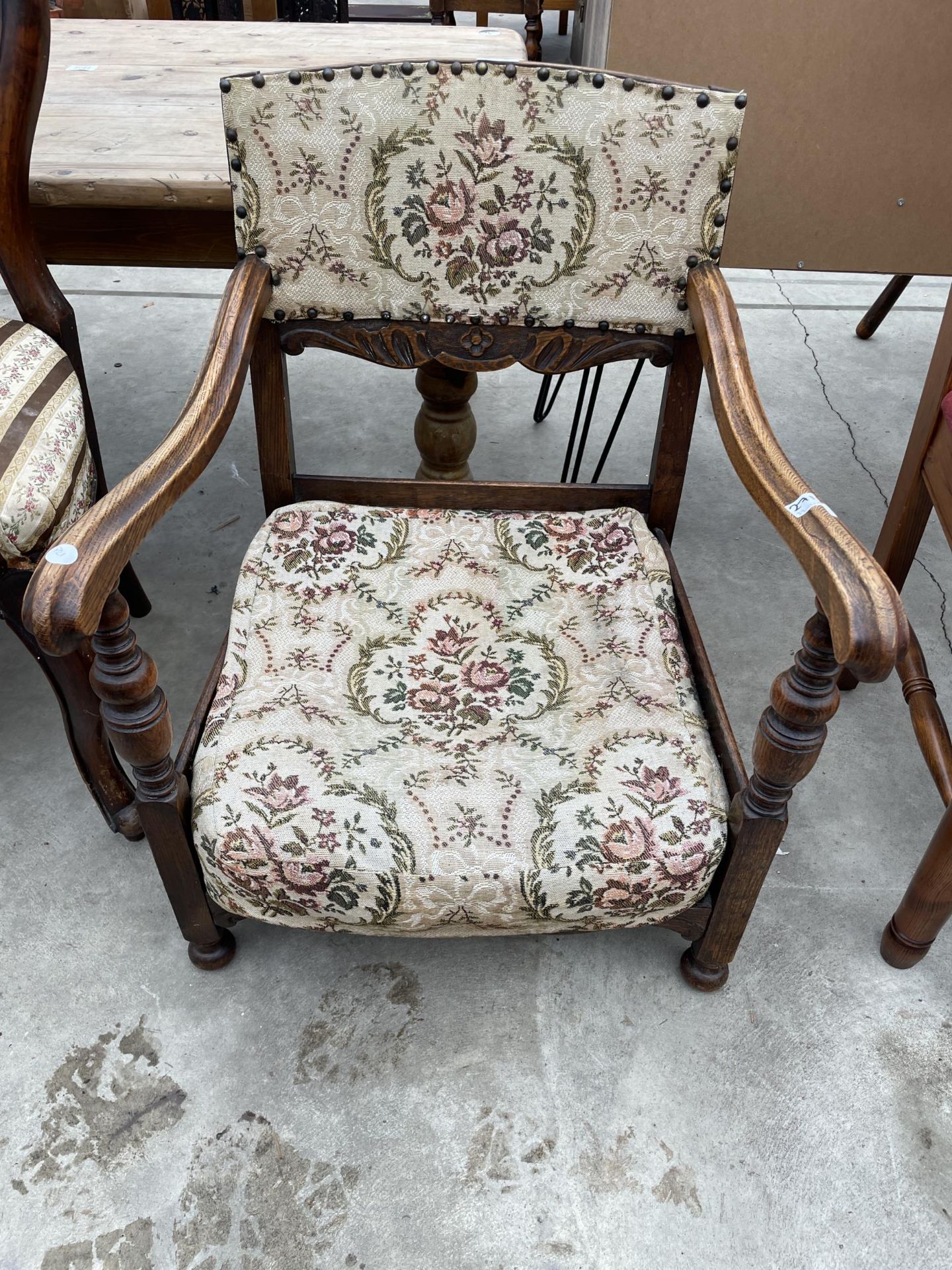 A MID 20TH CENTURY OAK LOW FIRESIDE CHAIR