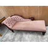 A VICTORIAN BEECH FRAMED CHAISE LONGUE ON TURNED LEGS