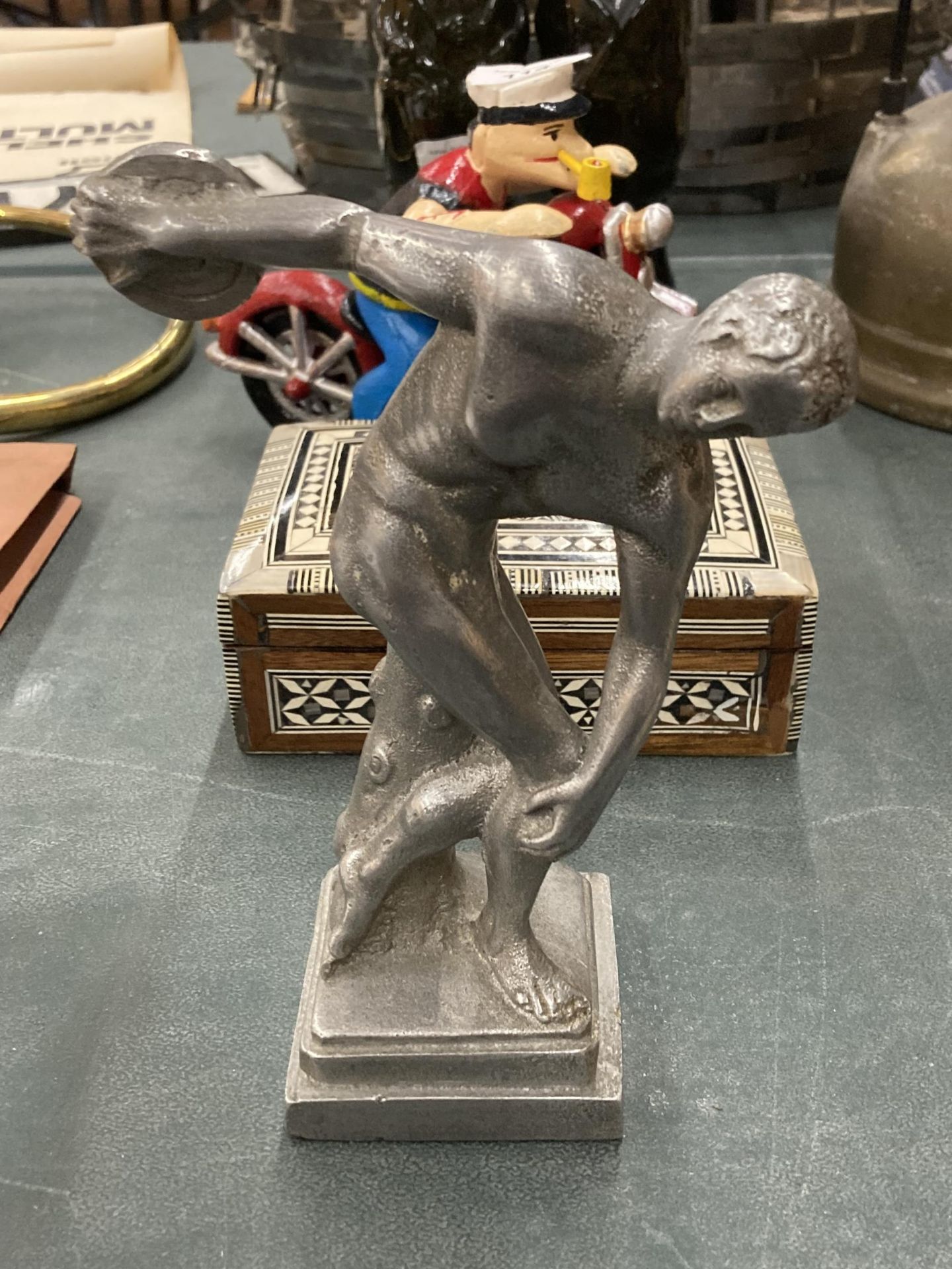 A CHROME EFFECT MODEL OF A DISCUS THROWER