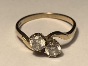 A 9 CARAT GOLD RING WITH TWO CUBIC ZIRCONIAS ON A TWIST DESIGN SIZE J