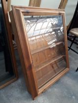 A PINE GLASS FRONTED WALL CABINET
