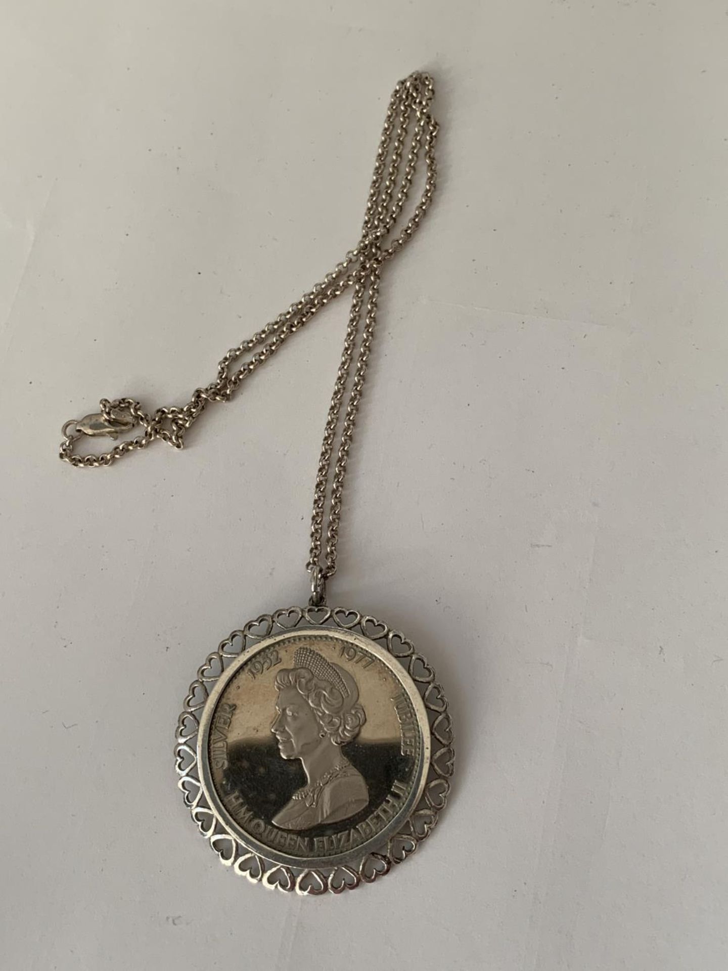 A SILVER JUBILEE COIN NECKLACE