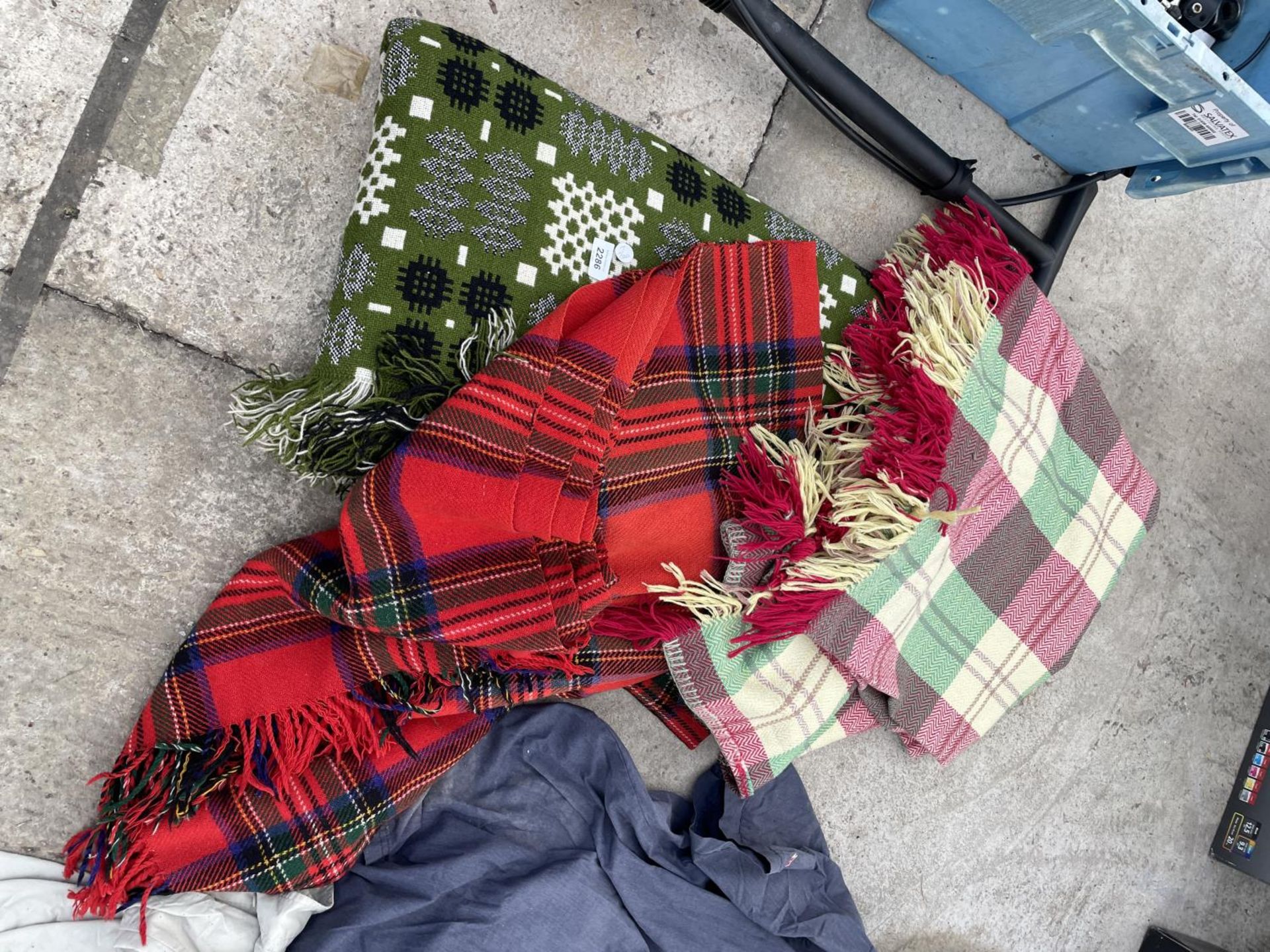 THREE VARIOUS PATTERNED BLANKETS