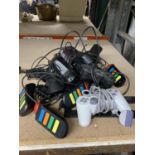 A QUANTITY OF PLAYSTATION CONTROLLERS