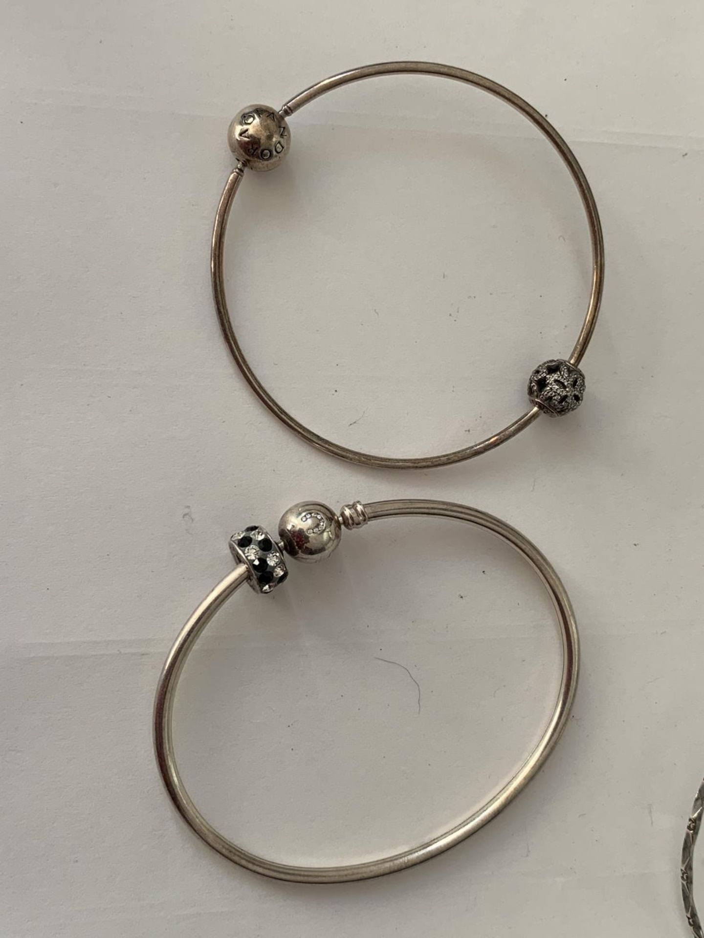 FIVE VARIOUS SILVER BANGLES TO INCLUDE A PANDORA AND A CHAMILIA - Image 2 of 4