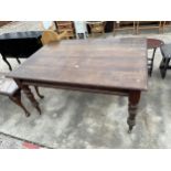 A LATE VICTORIAN MAHOGANY AND BEECH DINING TABLE ON TURNED LEGS, 60 X 41"