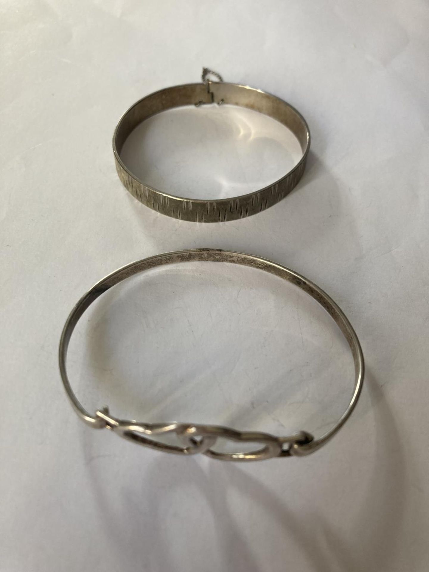 TWO SILVER BANGLES