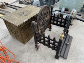 A DECORATIVE CAST FIRE GRATE AND A BRASS COAL BOX