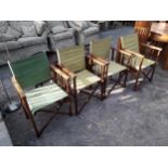 A SET OF FOUR DIRECTORS STYLE FOLDING CHAIRS