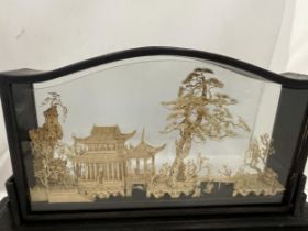 A VINTAGE CARVED ORIENTAL CORK DIORAMA IN A PRESENTATION FRAME