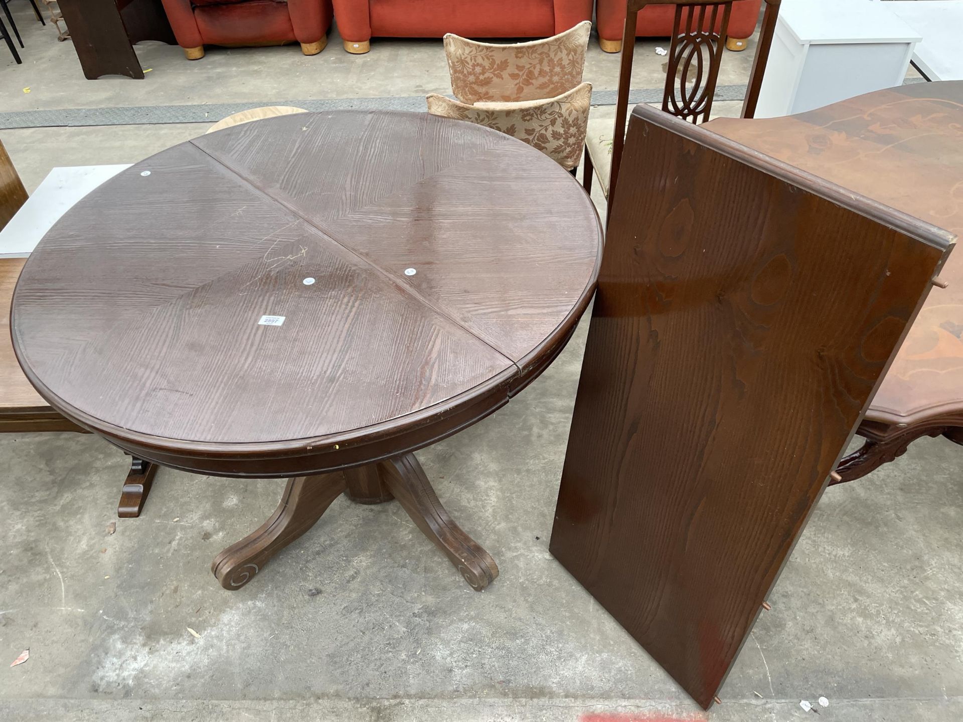 AN OAK 42" DIAMETER PEDESTAL DINING TABLE (LEAF 18")