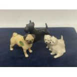 THREE BESWICK DOGS TO INCLUDE A PUG, SCOTTIE AND A PAIR OF WEST HIGHLAND TERRIERS