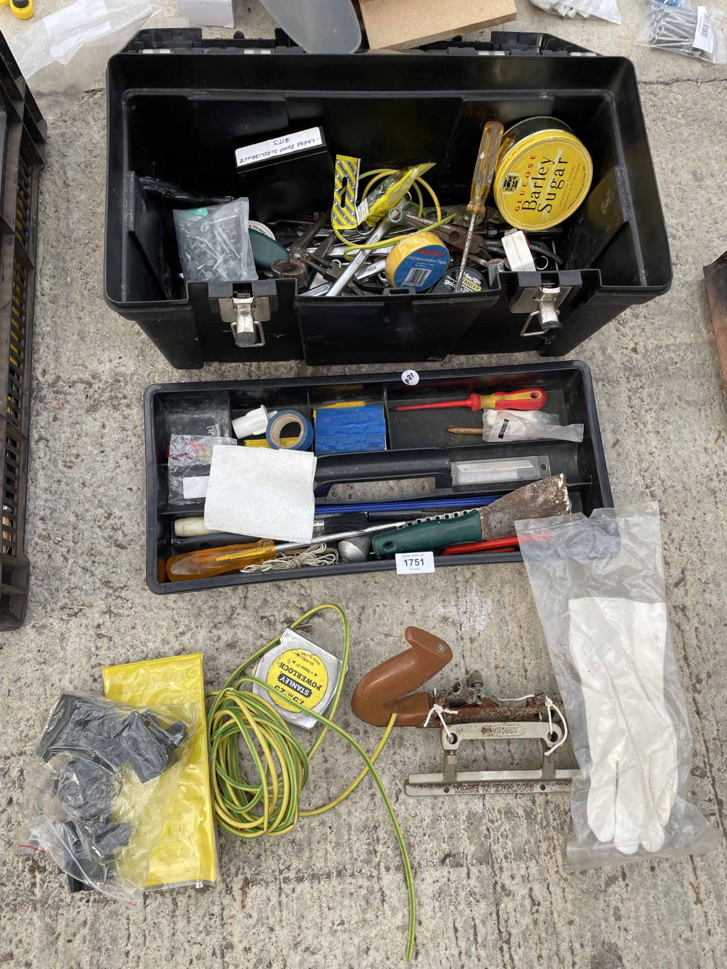 A TOOL BOX CONTAINING AN ASSORTMENT OF TOOLS TO INCLUDE A WOOD PLANE AND SPANNERS ETC