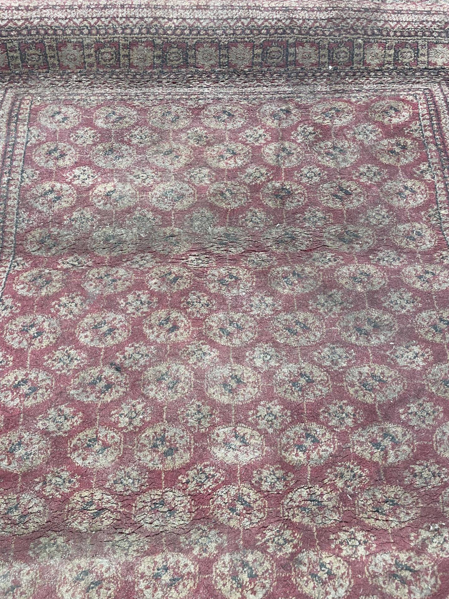 A RED PATTERNED 'TIARA' RUG - Image 2 of 2