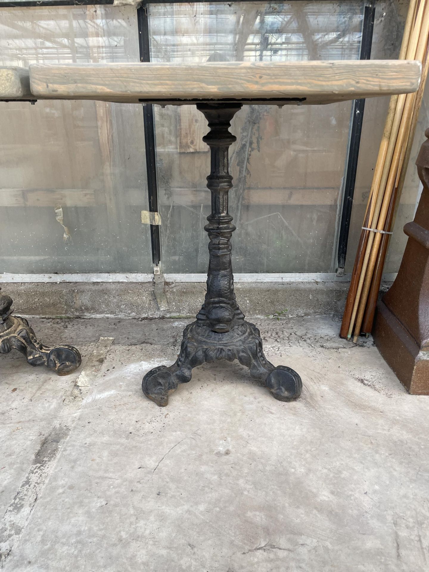 A SQUARE PUB TABLE WITH CAST IRON BASE - Image 2 of 4