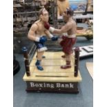 A HEAVY CAST BOXING MONEY BANK, FIGHTERS MOVE AND THROW PUNCHES