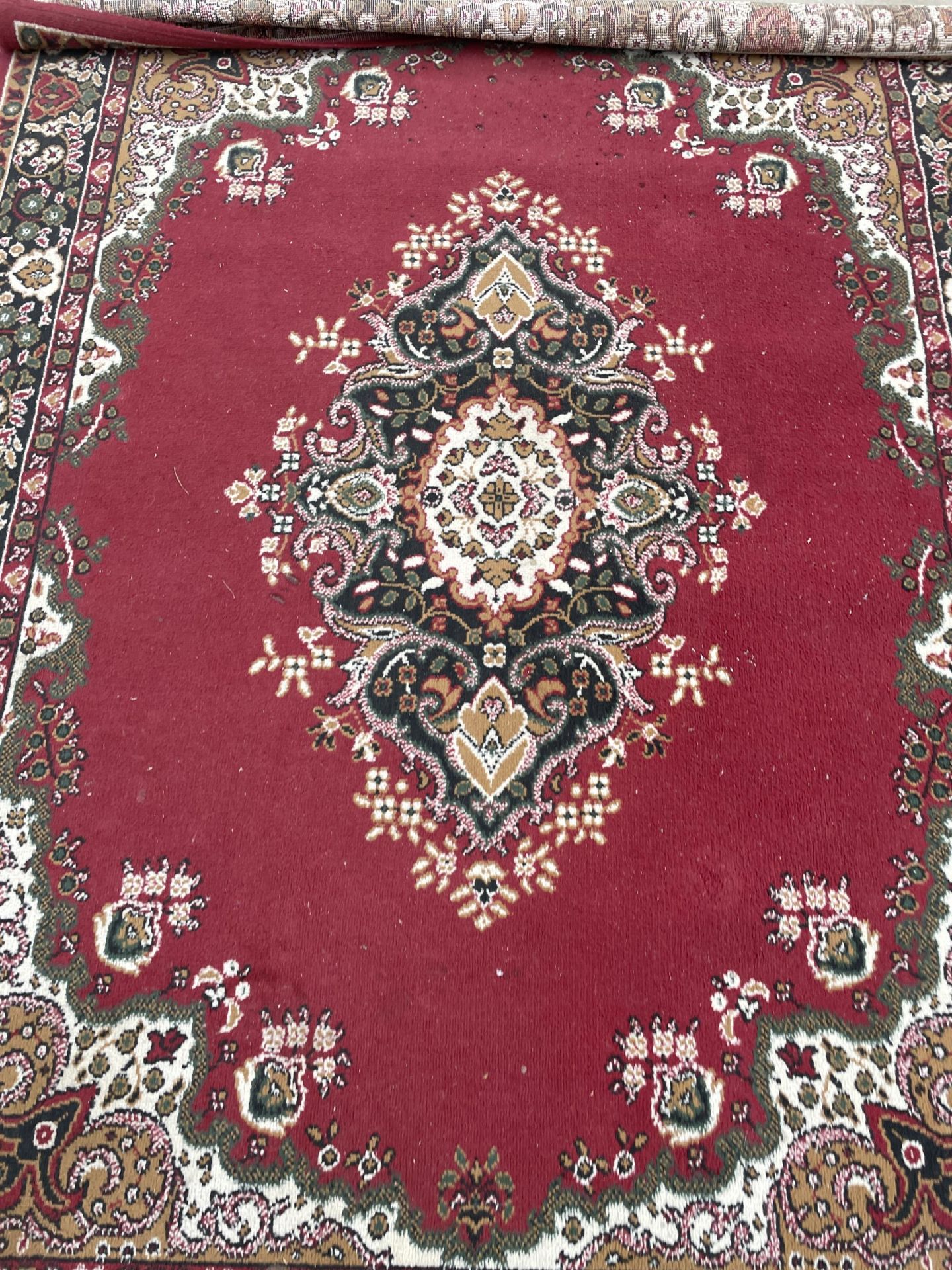 A RED PATTERNED RUG - Image 2 of 2