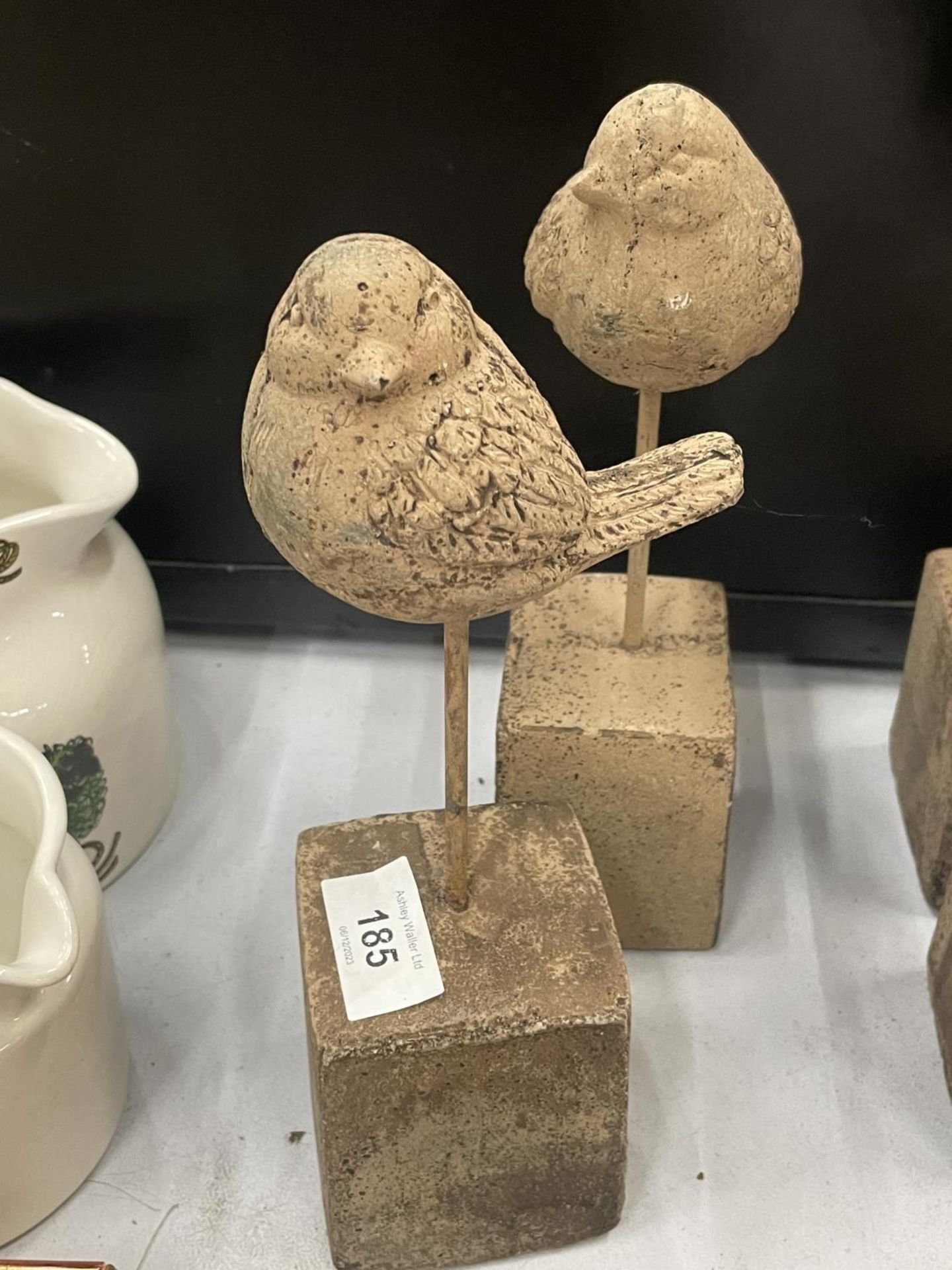 A PAIR OF STONE EFFECT BIRDS