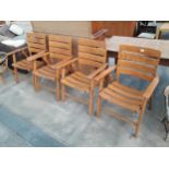 A SET OF FOUR BEECH FRAMED FOLDING GARDEN CHAIRS