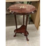 AN ORNATE TRIPOD SIDE TABLE