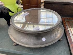 A MIRRORED PEWTER CAKE STAND WITH BRASS FEET