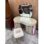 A MID 20TH CENTURY KIDNEY SHAPED DRESSING TABLE WITH PULL ROUND CURTAIN AND MATCHING STOOL