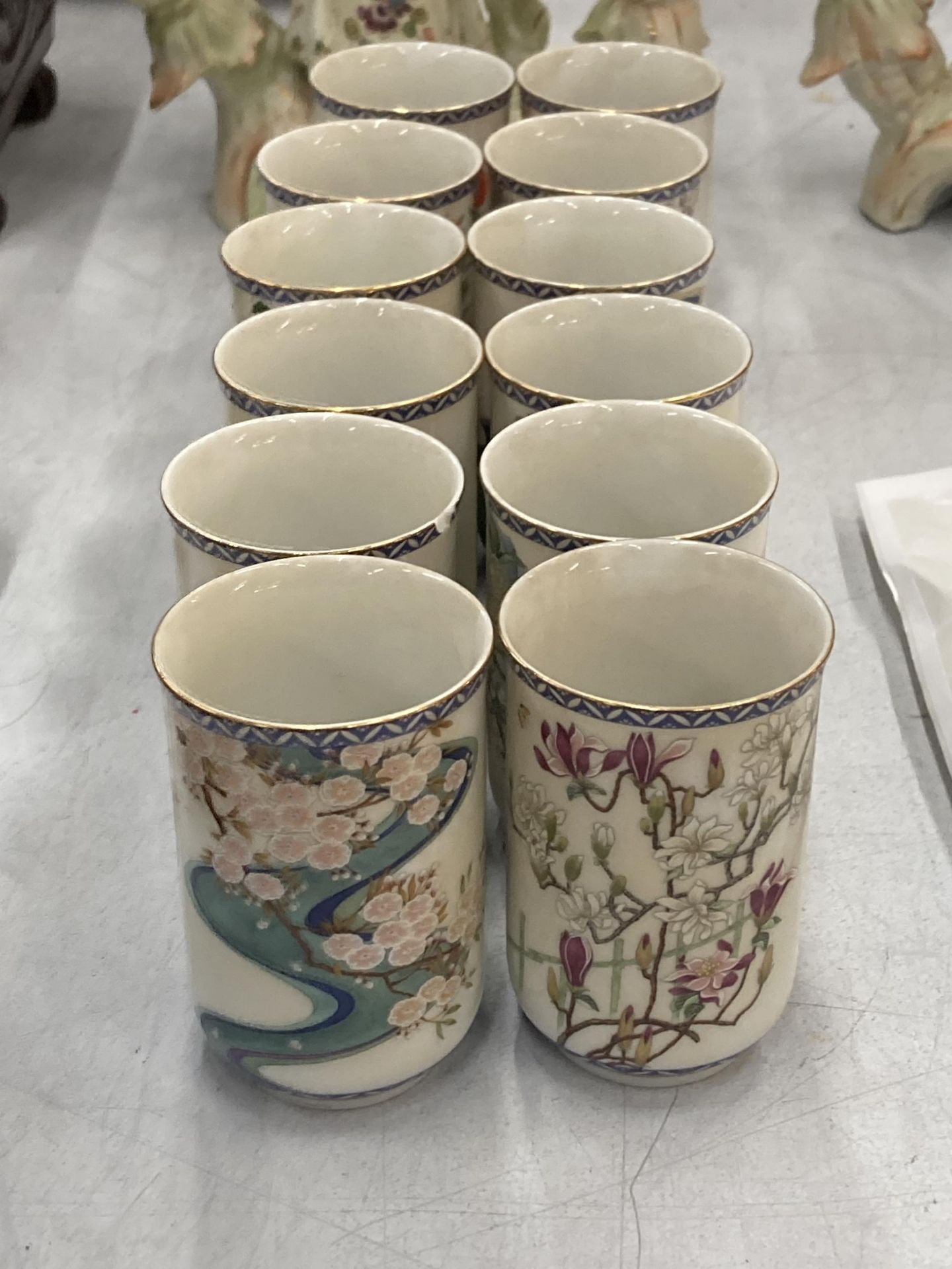 A SET OF TWELVE JAPANESE CUPS
