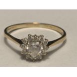 A 9 CARAT GOLD RING WITH A CENTRE HEART DESIGN CUBIC ZIRCONIA SURROUNDED BY THE SAME STONE SIZE T/U