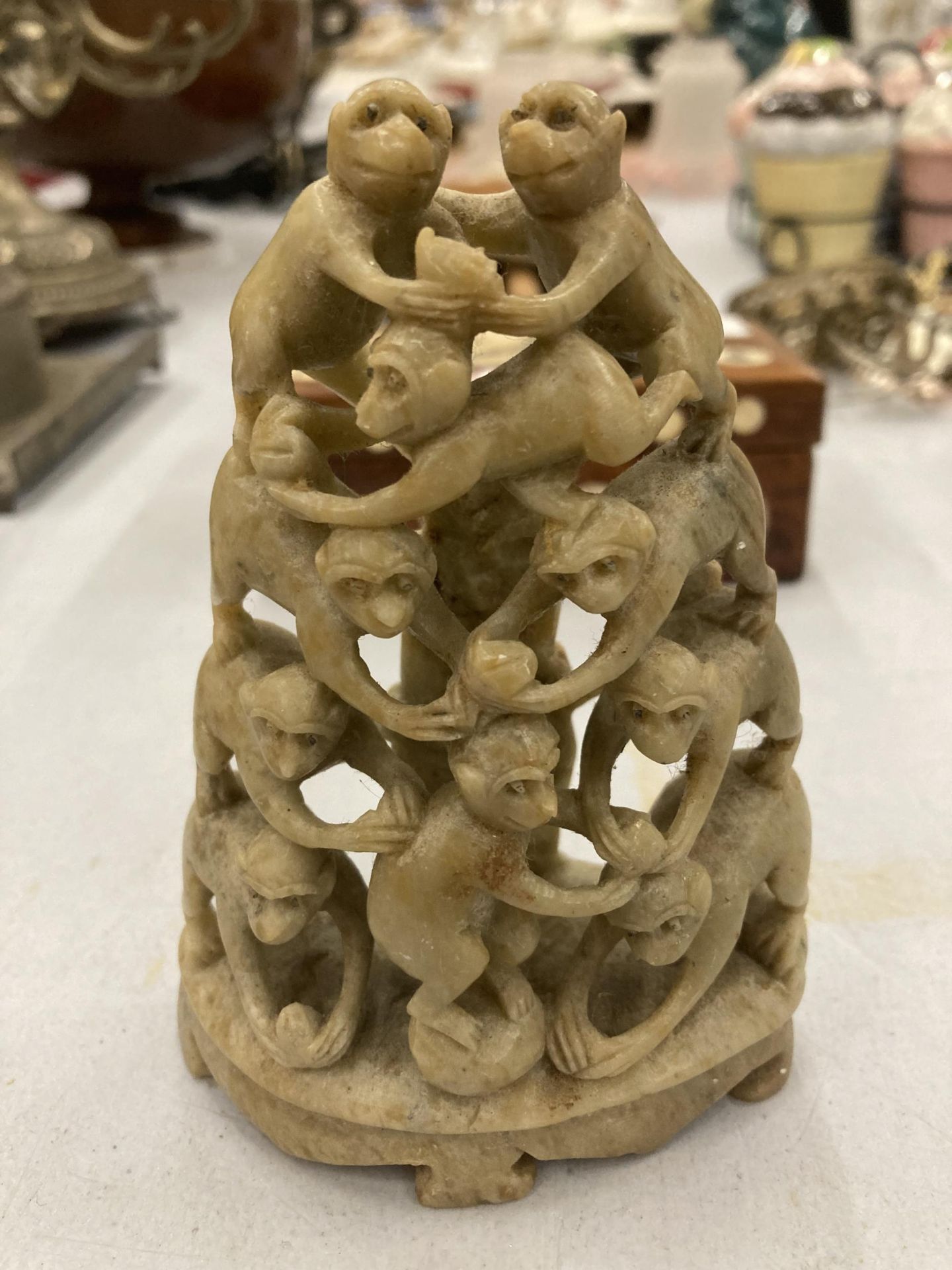 A VINTAGE ORIENTAL HARDSTONE MONKEY TOWER STATUE