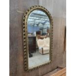 A MODERN GILT FRAMED WALL MIRROR, 34 X 19"