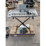 A YAMAHA ELECTRIC KEYBOARD WITH BOX