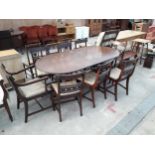A REGENCY STYLE TWIN-PEDESTAL DINING TABLE AND EIGHT CHAIRS, TWO BEING CARVERS