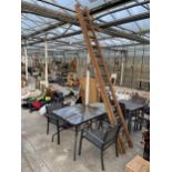 AN ASSORTMENT OF GARDEN ITEMS TO INCLUDE TWO BISTRO TABLES AND TWO CHAIRS ETC