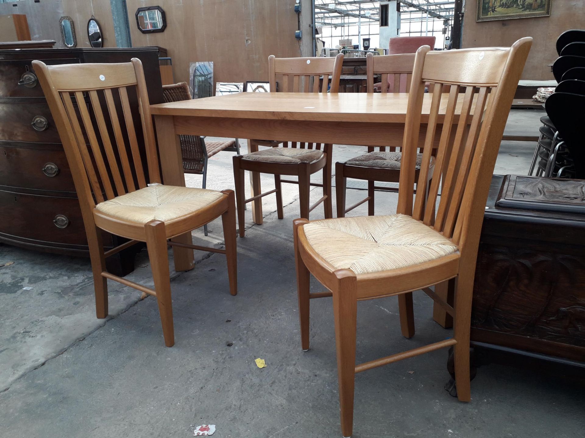 A MODERN OAK EXTENDING DINING TABLE, 52 X 32" (LEAF 19") AND FOUR RUSH SEATED CHAIRS - Image 3 of 3