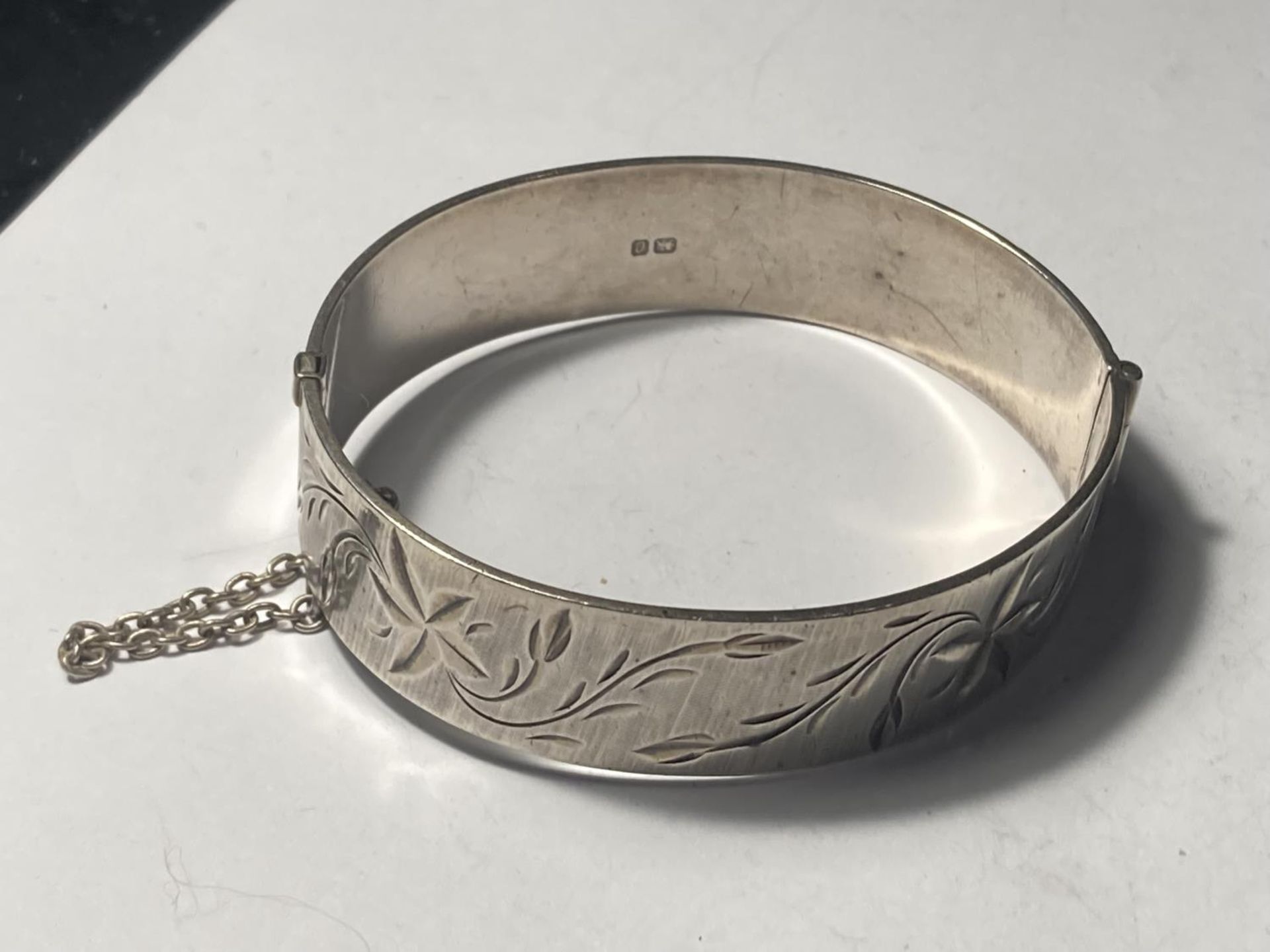 A HALLMARKED BIRMINGHAM SILVER BANGLE