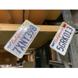 TWO US STYLE METAL NUMBER PLATES