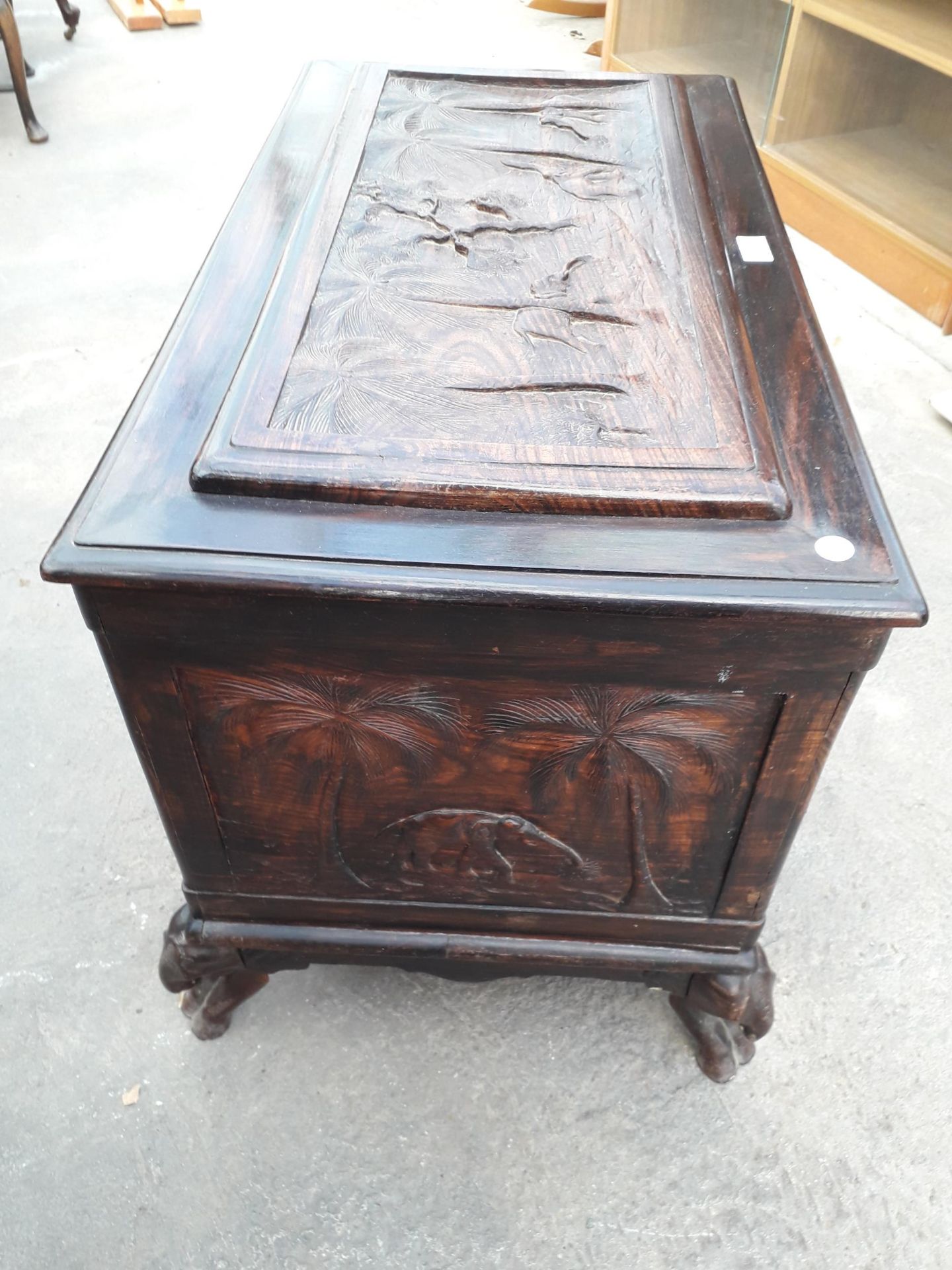 AN ORIENTAL HARDWOOD BLANKET CHEST PROFUSELY CARVED WITH ELEPHANTS AND TREES, COMPLETE WITH LIFT-OUT - Image 2 of 8