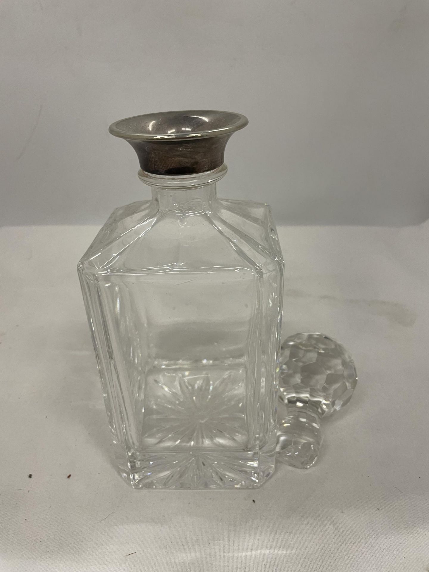 A CUT GLASS DECANTER (STOPPER A/F) WITH A TESTED TO SILVER COLLAR - Image 2 of 2