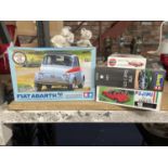 FOUR CAR MODEL KITS TO INCLUDE AN AIRFIX JAGUAR 'E' TYPE, REVELL VW GOLF 1 GTI, TAMIYA FIAT ABARTH