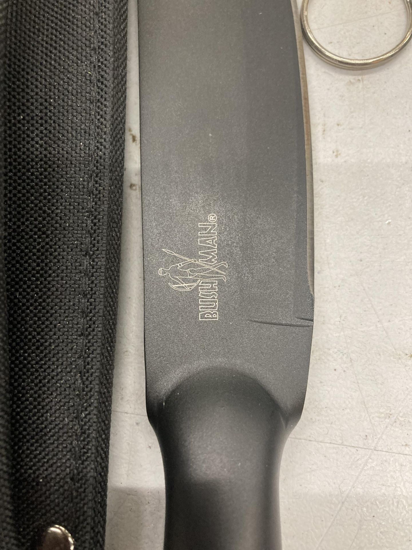 A BUSH MAN KNIFE WITH CASE AND SHARPENING TOOL - Image 2 of 4