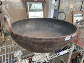 A VINTAGE STEEL TWIN HANDLED BOWL