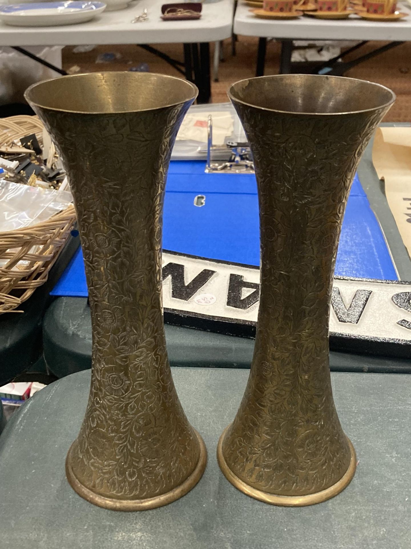 A PAIR OF BRASS ORNATE TRUMPET VASES