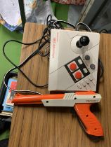 A NINTENDO NES ADVANTAGE CONSOLE AND GUN