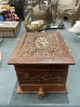 A MIDDLE EASTERN CARVED AND INLAID WOODEN BOX
