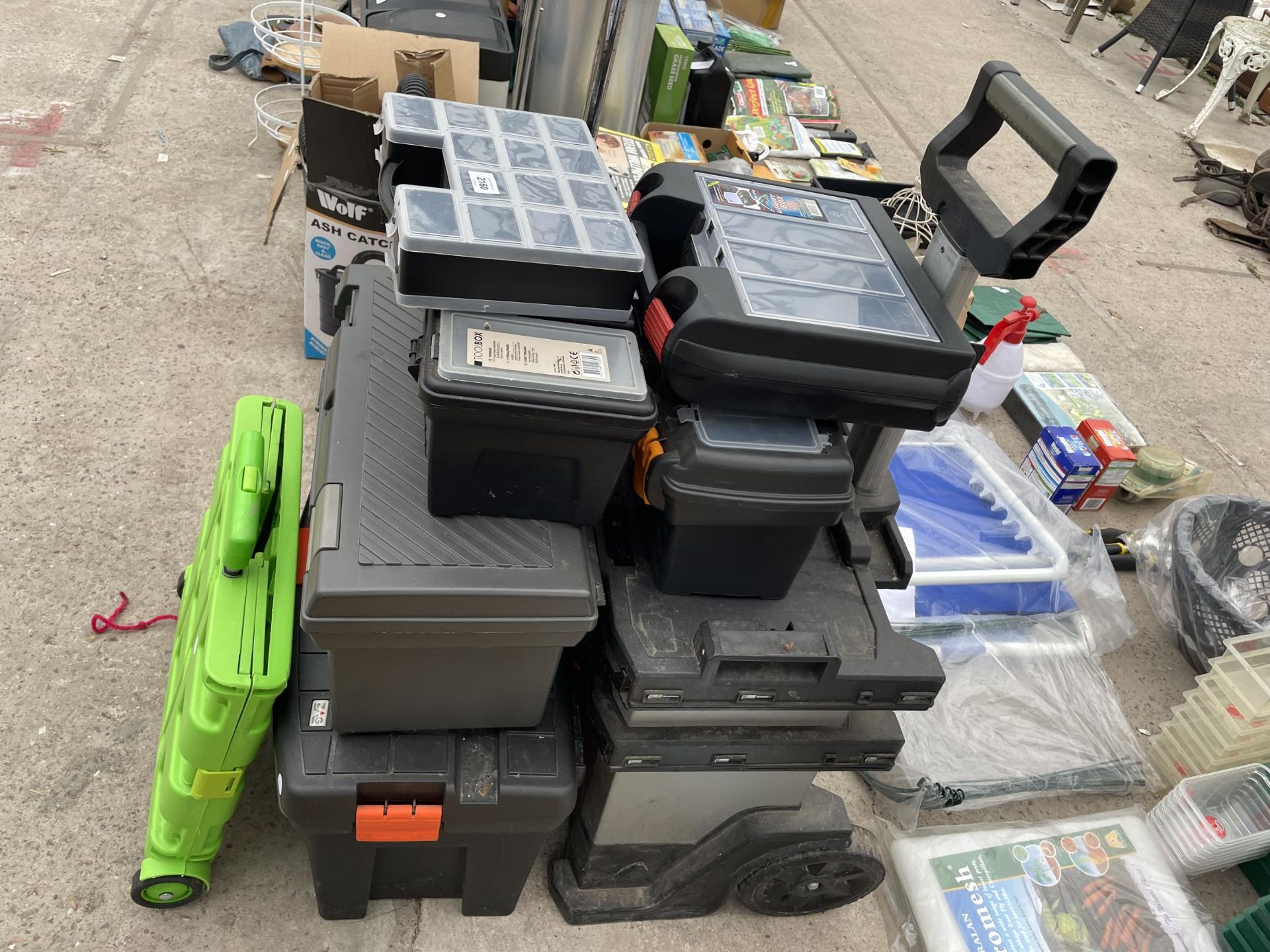 AN ASSORTMENT OF PLASTIC TOOL BOXES AND TROLLIES