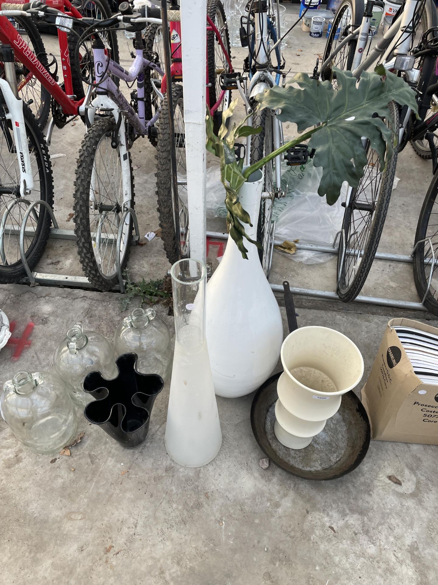 AN ASSORTMENT OF GLASS VASES AND THREE DEMI JOHNS ETC