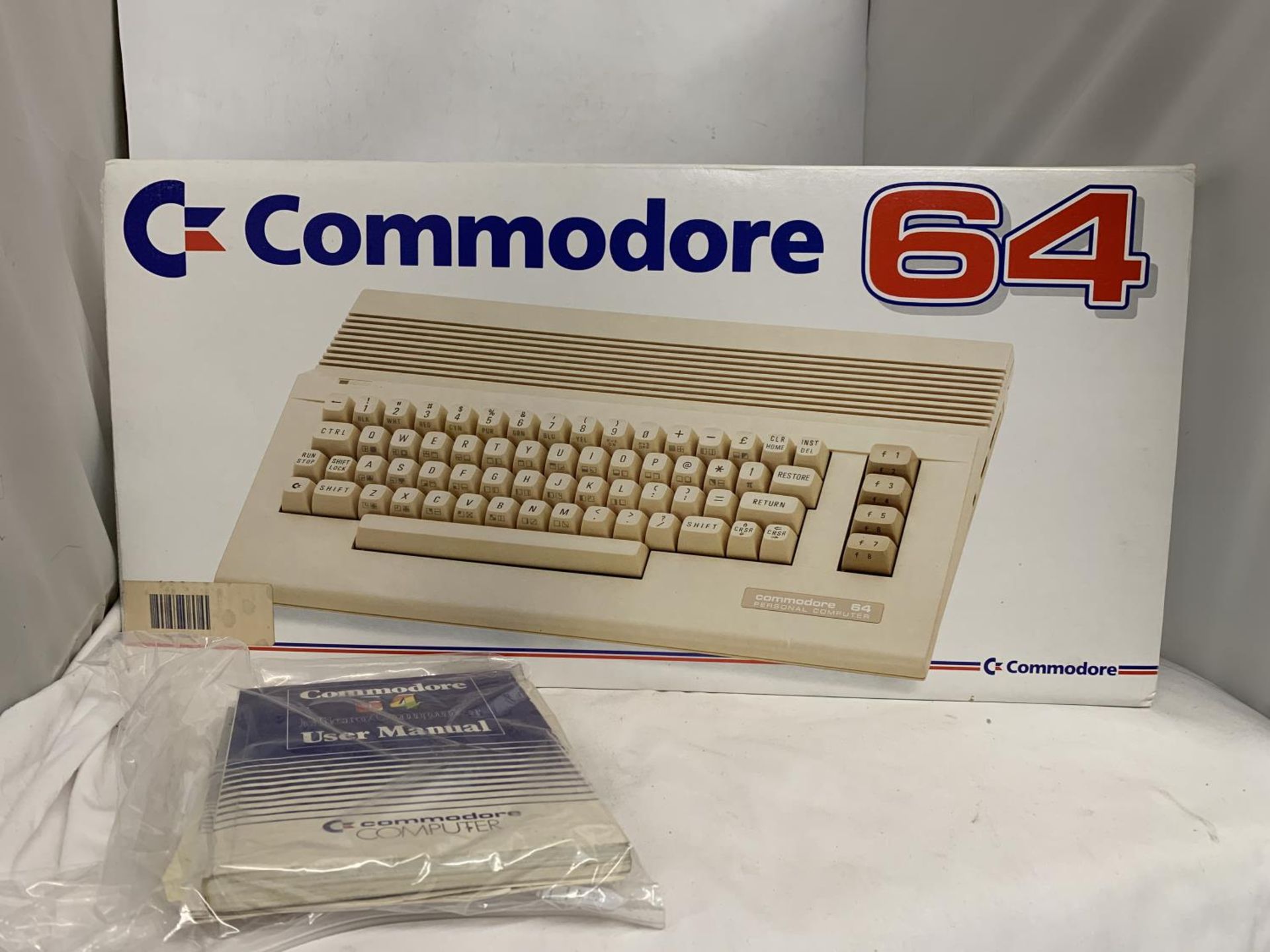 A BOXED COMMODORE 64C COMPUTER BUNDLE TO INCLUDE CASSETTE UNIT, JOYSTICK, HOLLYWOOD GAMES SUCH AS - Image 3 of 4